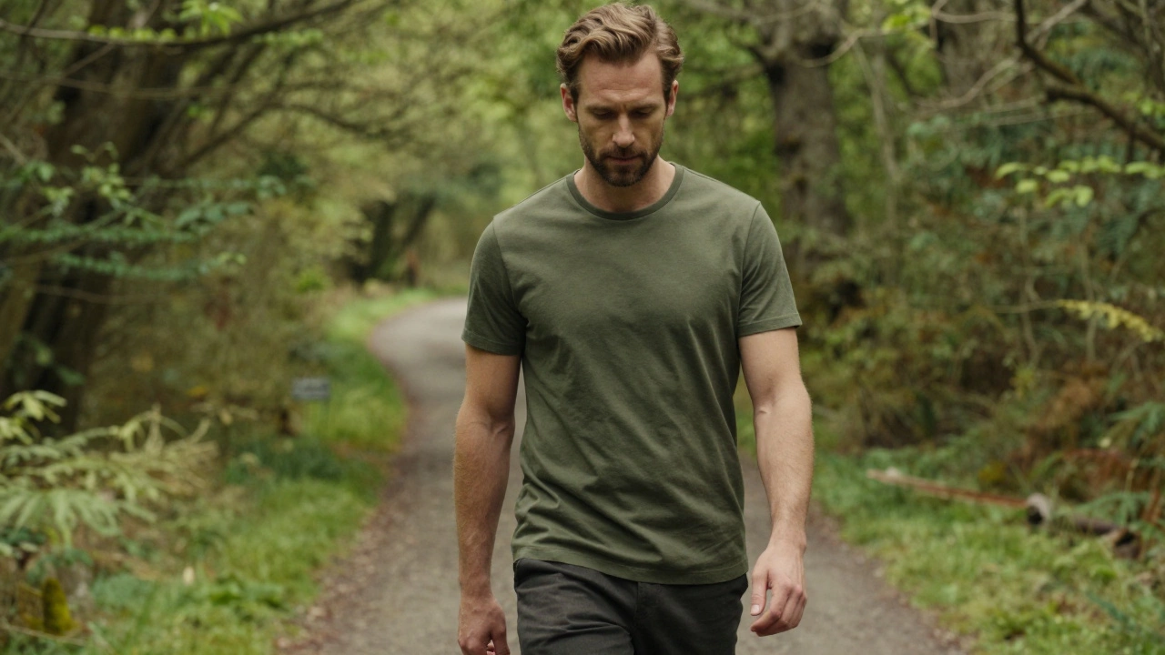 Man in olive green tee in misty Irish forest